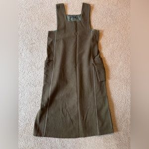 Wool jumper. Army green. 2 outer pockets. Brand is Gudrun Sjoden.